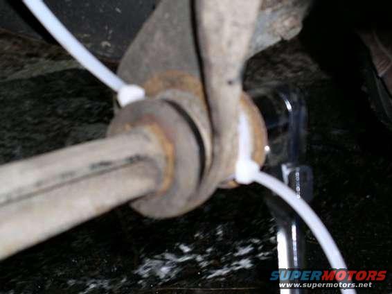 A piece of nylon strap and a couple of zip ties. Works like a charm!
