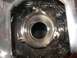 1998 Lincoln Mark VIII - Close-up of a chrome headlight assembly, showing mounting points and reflective interior surfaces.