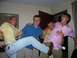 1983 Ford F-250 - Four men are captured in a candid moment, striking poses indoors.