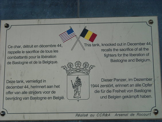 Plaque with US and Belgian flags, commemorating a tank destroyed in December 1944