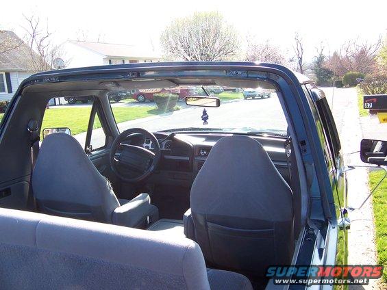 Interior view of a 1995 Ford Bronco, showing front seats and dashboard