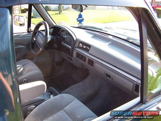 1995 Ford Bronco interior showing dashboard, steering wheel, and seats