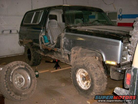 Black 1988 Chevrolet Blazer with driver's door removed, seen from 3/4 front