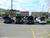 1997 Pontiac Grand Am - A row of vehicles including several SUVs and a white car are parked in an outdoor lot.