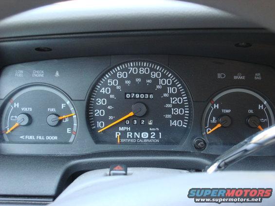 Dashboard gauges showing 79,036 miles, fuel, volts, temperature, and oil