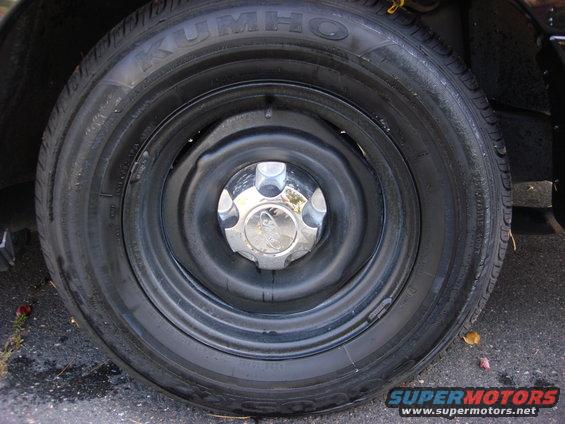 Wheel with Kumho tire and chrome hubcap