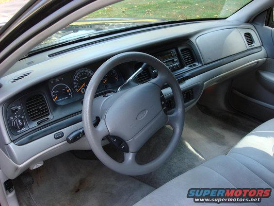 2003 Ford Crown Victoria interior showing dashboard, steering wheel, and seats