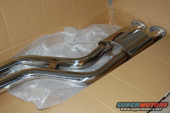 Chrome exhaust muffler and pipes in a cardboard box