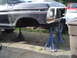 1979 Ford Bronco - Front end of a 1979 Ford Bronco is raised on jack stands for repair or restoration.
