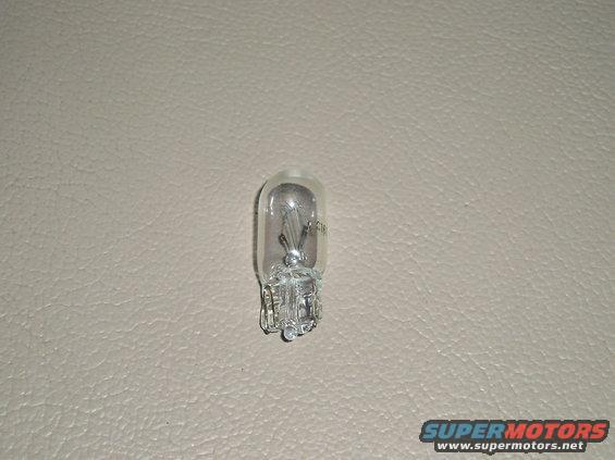 Automotive light bulb with visible filament and markings