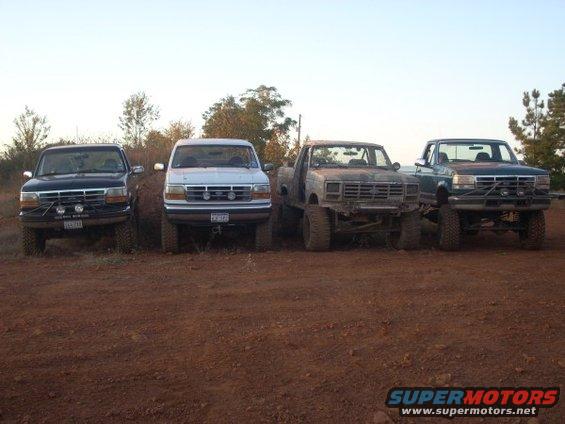 1992 Ford Bronco front view, parked with three other trucks