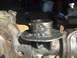 1994 Jeep Cherokee - Close-up of a metal ring welded onto a vehicle's axle housing, showing signs of modification and repair.
