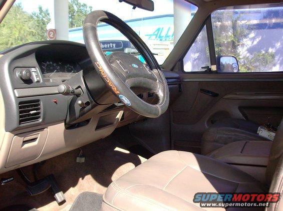 Interior shot of a Ford truck showing the dashboard, steering wheel, and seats. A 'Supermotors.net' watermark is visible