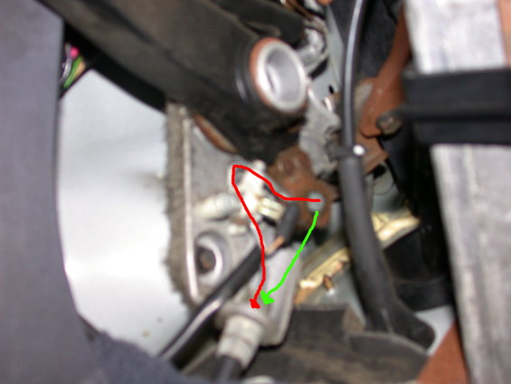 The red path is where the cable rests when the parking brake is released.  I'm assuming it should be where the green line is.