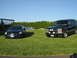 1998 Chevrolet Tahoe - This black 1995 Chevrolet Tahoe is parked on a grassy lawn with a blue sedan.