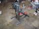1989 Ford F-250 - A metal fabrication tool, likely a pipe bender, is shown on a portable stand in a workshop setting.