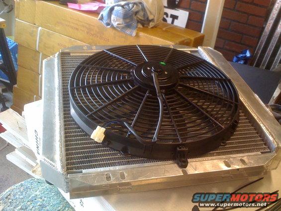 Aluminum radiator with black electric fan assembly, labeled 'CHINA' on the side