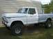 1988 Ford Bronco - This lifted pickup truck, likely from the 1970s, is shown from the side.