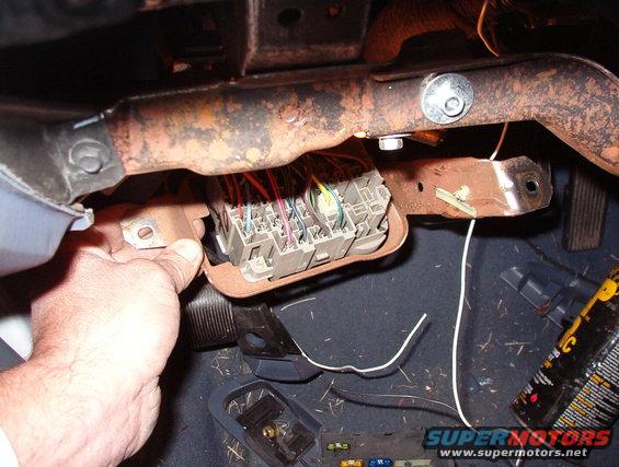 mirrors02.jpg The Br/LB comes in from the defrost relay under the hood, and the tiny DG/Pu goes out to the rear window defrost grid (through the antenna adapter).  I'll solder my white wires onto that terminal so the circuit is identical to OE.  The '98 fuse #17 is the same size (10A) as the later car's.