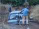 1988 Chevrolet Blazer - Two men attempt to free a gray SUV that is stuck deep in muddy terrain.