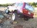 1998 Jeep Cherokee - This Jeep Cherokee is navigating a rocky trail, demonstrating its off-road capabilities.