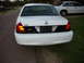 2001 Ford Crown Victoria - This 2001 Ford Crown Victoria has a black panel between its taillights and a Ford badge on the trunk lid.
