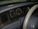 2001 Ford Crown Victoria - Interior view of a 2001 Ford Crown Victoria dashboard with gauges and steering wheel.