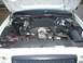 2001 Ford Crown Victoria - The engine compartment of a 2001 Ford Crown Victoria is shown with the hood open.