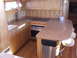 1976 Ford F-150 - This boat galley features a compact kitchen setup with modern appliances and ample counter space.