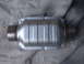 2002 Chevrolet Camaro - A catalytic converter is shown, a crucial exhaust system component for emissions control.