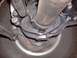 1978 Ford Bronco - Close-up of vehicle undercarriage components, including suspension and tire.