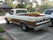 1972 Ford F-100 - This Ford F-100 pickup truck has a two-tone paint scheme and a toolbox mounted in the bed.