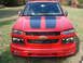 2008 Chevrolet Colorado - Front view of a red 2008 Chevrolet Colorado pickup truck with black racing stripes.