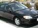 2002 Ford Taurus - This black 2002 Ford Taurus sedan features a sunroof and is captured in a 3q front view.