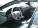 2002 Ford Taurus - The interior of a 2002 Ford Taurus is captured, highlighting the driver's side controls and dashboard.
