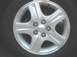 2002 Ford Taurus - Close-up of a silver alloy wheel. The registry claims it is from a 2002 Ford Taurus, but this is unconfirmed.