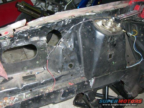 Engine bay frame rail with suspension mount