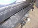 1993 Ford Bronco - Close-up of a vehicle's rear bumper and tow hitch assembly, with partial text visible on an upper plate.