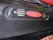 1993 Ford Bronco - This is a close-up view of a vehicle's rear bumper, showing a reflector and vent details.