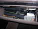 1993 Ford Bronco - The contents of a vehicle's glove compartment are visible, including various bags and a container of fuses.