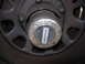 1993 Ford Bronco - This photo shows a Warn manual locking hub, a part of a vehicle's drivetrain.