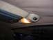1993 Ford Bronco - Close-up of the interior dome light and overhead console in a vehicle.