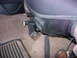 1993 Ford Bronco - Interior shot focusing on a seat adjustment mechanism and a mesh seat cover.