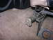 1993 Ford Bronco - The image shows a close-up of a seat adjustment lever mechanism inside a vehicle.