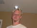 1992 Ford Bronco - A man with a goatee wears a flashlight on his head, secured by tape and straps.