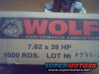 Cardboard box labeled WOLF PERFORMANCE AMMUNITION 7.62 x 39 HP 1000 RDS. LOT No F791-0. SuperMotors.net logo visible