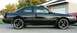 1989 Mazda MX-6 - This black 1989 Mazda MX-6 coupe is shown from the side, aftermarket wheels and a spoiler.