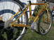 1994 Ford Probe - A gold Trek bicycle is shown outdoors with its drivetrain and wheels visible.