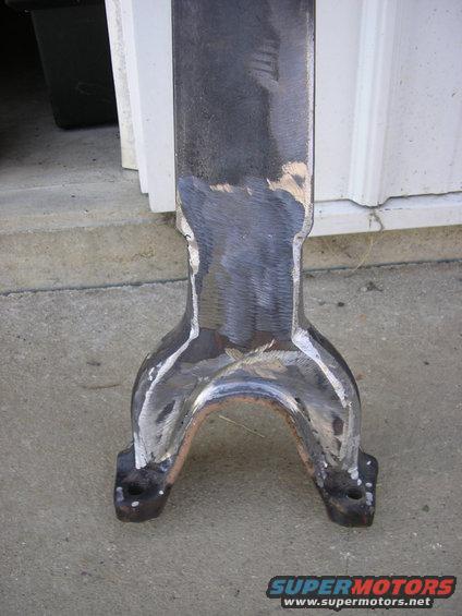 Driveshaft yoke with evidence of welding and grinding