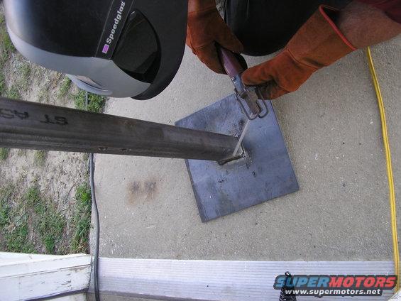 Welding metal pipe to square plate
